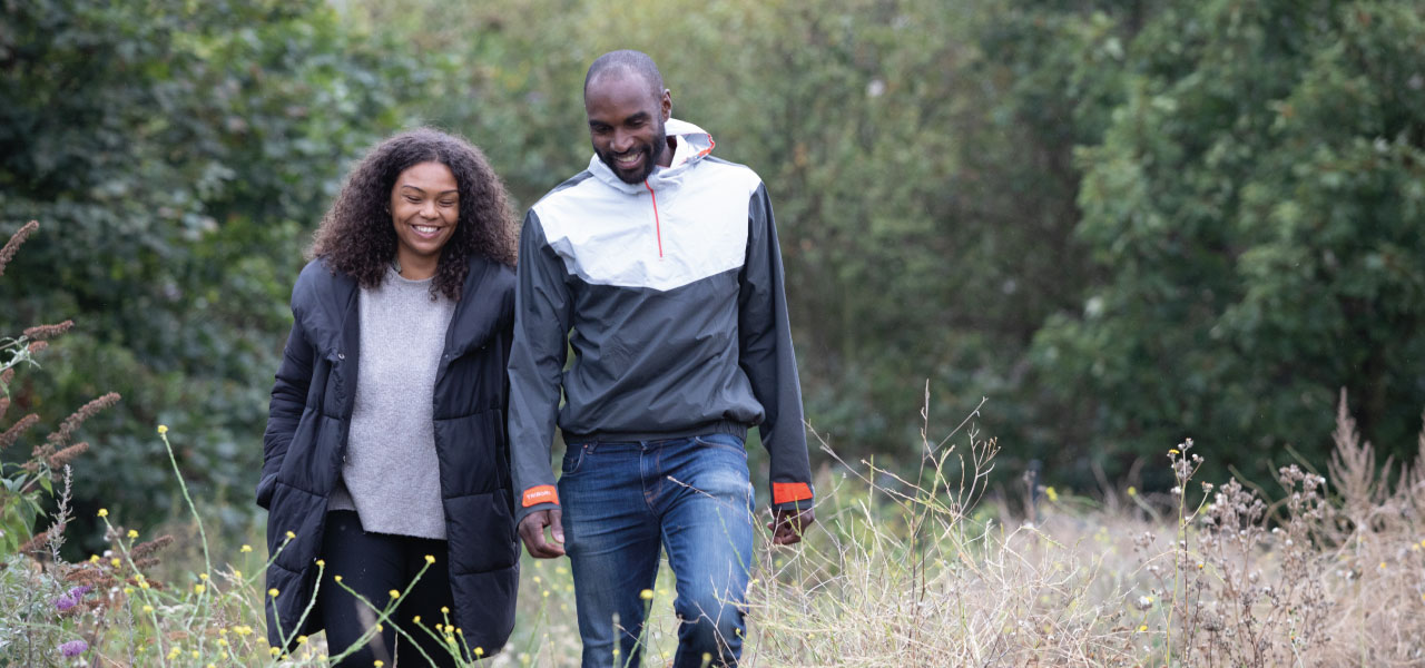 A couple walking and laughing together